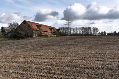 House on field against sky