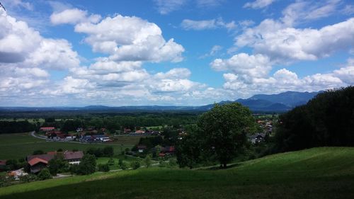 Scenic view of landscape against cloudy sky