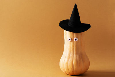 Close-up of bread on table against wall