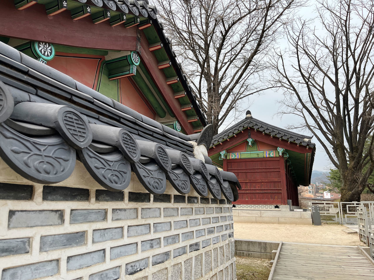 architecture, built structure, building exterior, building, tree, no people, bare tree, roof, nature, day, plant, house, history, the past, tradition, wall, outdoors, sky, residential district, religion, city, belief, travel destinations, eaves, temple - building, facade