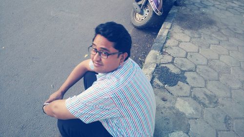 High angle view of man standing on street