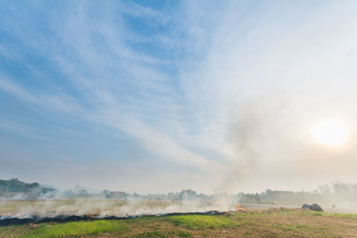 Fire on field against sky