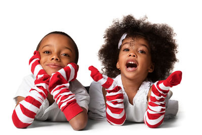 Portrait of smiling boy against white background
