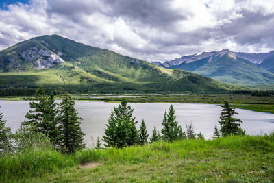 Scenic view of lake and mountains against sky