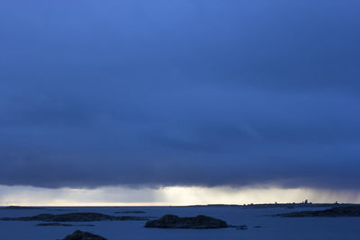 Scenic view of sea against sky during winter