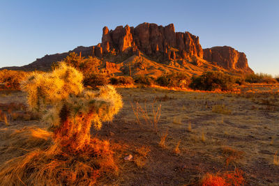 Rock formations on landscape against sky