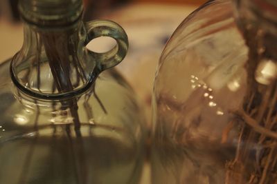 Close-up of glass bottle on table