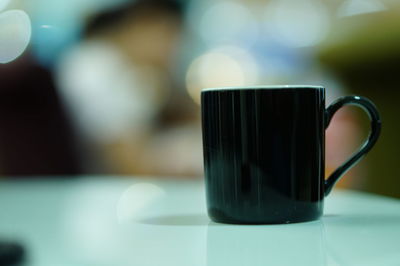 Close-up of coffee cup on table