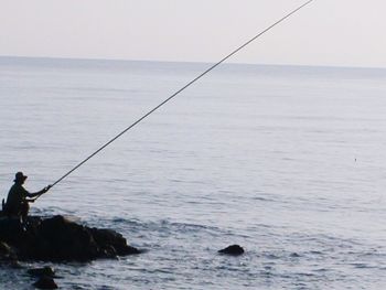 Man fishing in sea