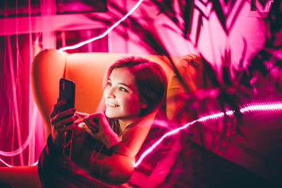 Young woman using mobile phone