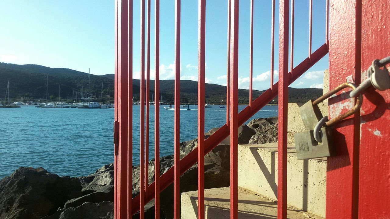 SCENIC VIEW OF MOUNTAIN BY WATER