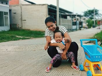 Full length of father and daughter outdoors