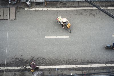 High angle view of people working on road