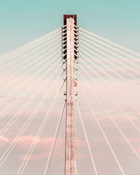 Low angle view of suspension bridge against clear sky