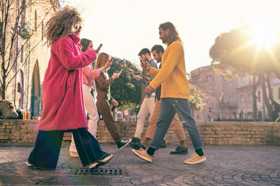 People walking on street in city