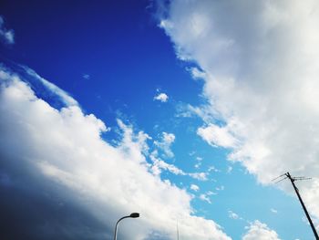 Low angle view of street light against sky