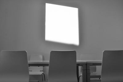 Empty chair and table in room