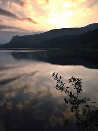 Scenic view of calm lake at sunset