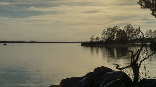 Scenic view of lake against sky during sunset