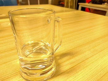 Close-up of beer glass on table