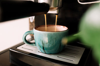 Close-up of coffee cup on table