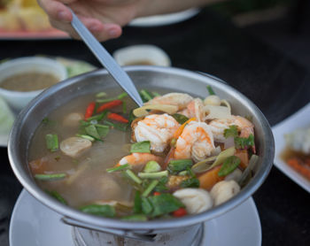 Close-up of fresh tom yum soup in bowl