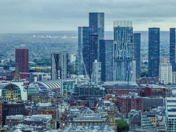 Modern buildings in city against sky