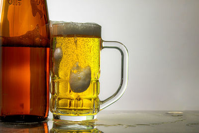 Close-up of beer glass on table