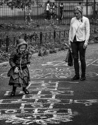 Full length of boy standing in park