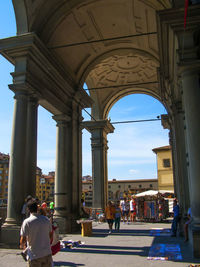 Tourists at entrance of historical building