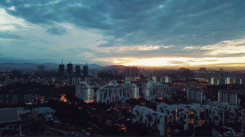 Aerial view of city during sunset