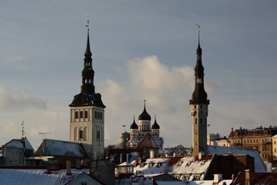 Buildings in city against sky