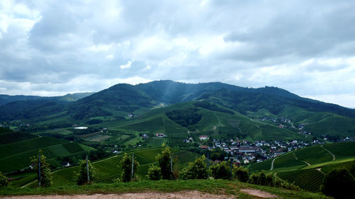 Scenic view of landscape and mountains against sky