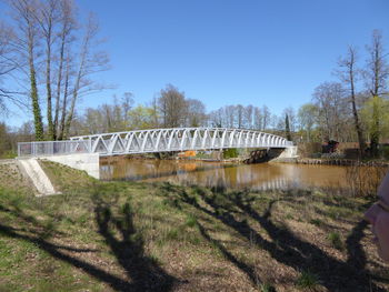 Bridge over river against clear sky