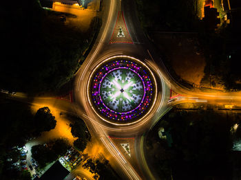 High angle view of light trails on road in city at night