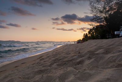 Scenic view of beach against sky during sunset