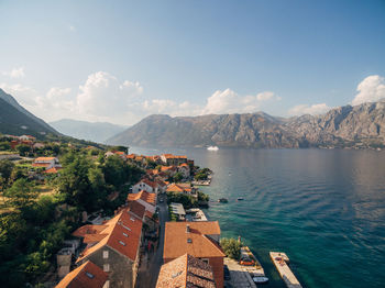 Panoramic shot of townscape by sea against sky