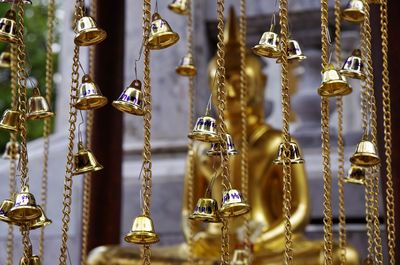 Close-up of decorations hanging at market stall