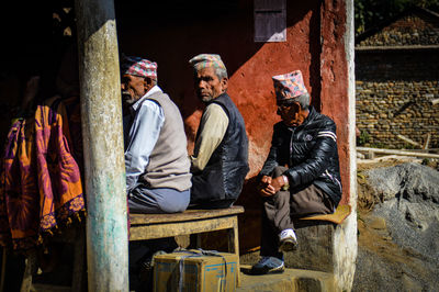 Men sitting in a row