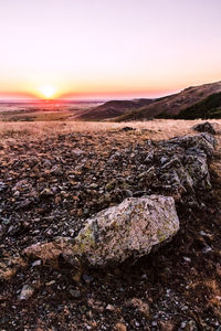 Scenic view of landscape at sunset