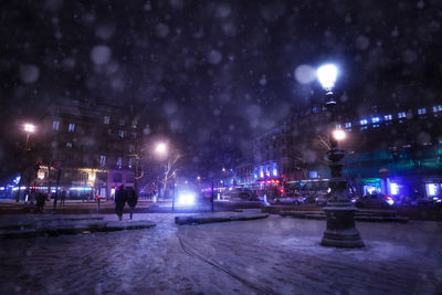 Illuminated street lights in winter at night