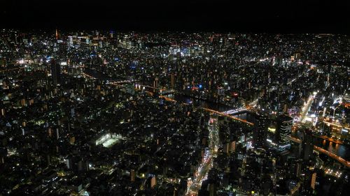 Aerial view of illuminated cityscape at night