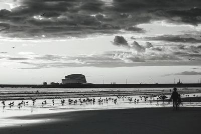 Scenic view of sea against cloudy sky