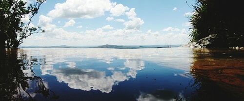 Scenic view of sea against cloudy sky