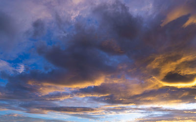 Low angle view of dramatic sky during sunset