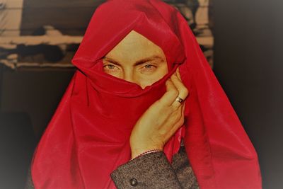 Close up of woman with red umbrella