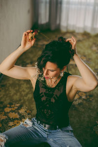 Young woman sitting on a field