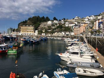 Boats moored at harbor