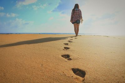 Woman standing on beach