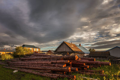 Scenic view of field against cloudy sky